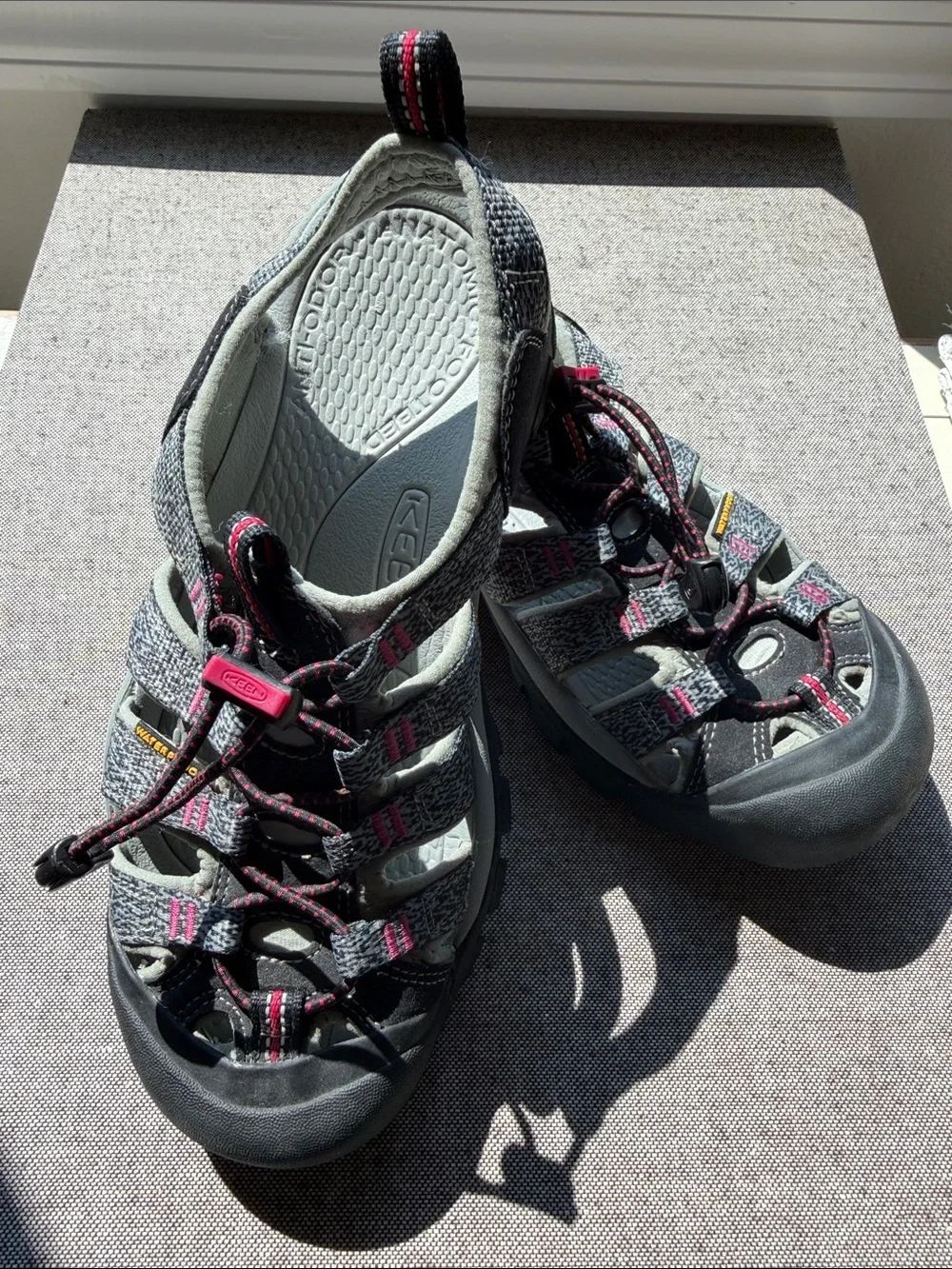 Keen Women’s waterproof Sandals. Gray with pink accents. Rugged soles for hiking